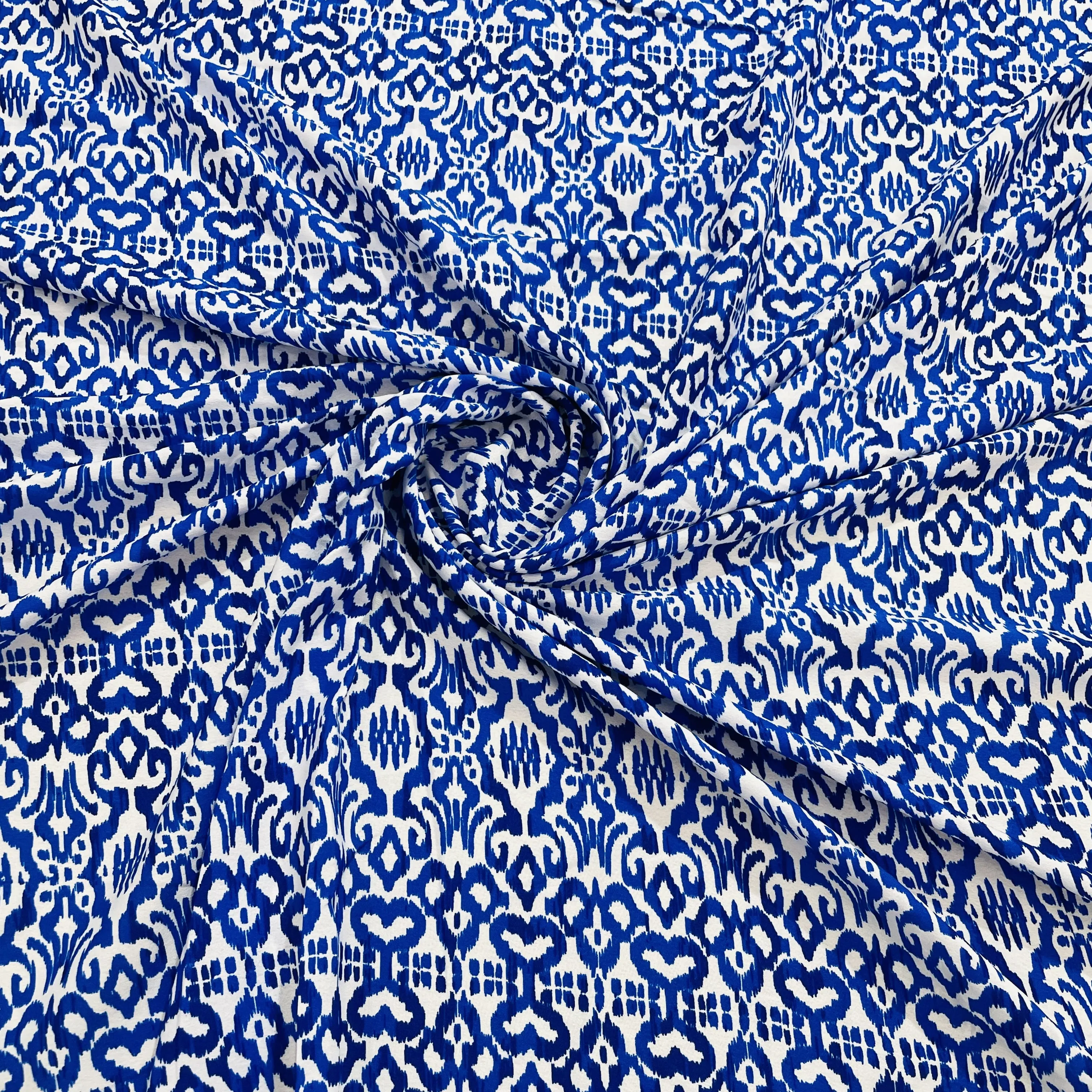 White & Blue Ikkat Print Crepe Fabric